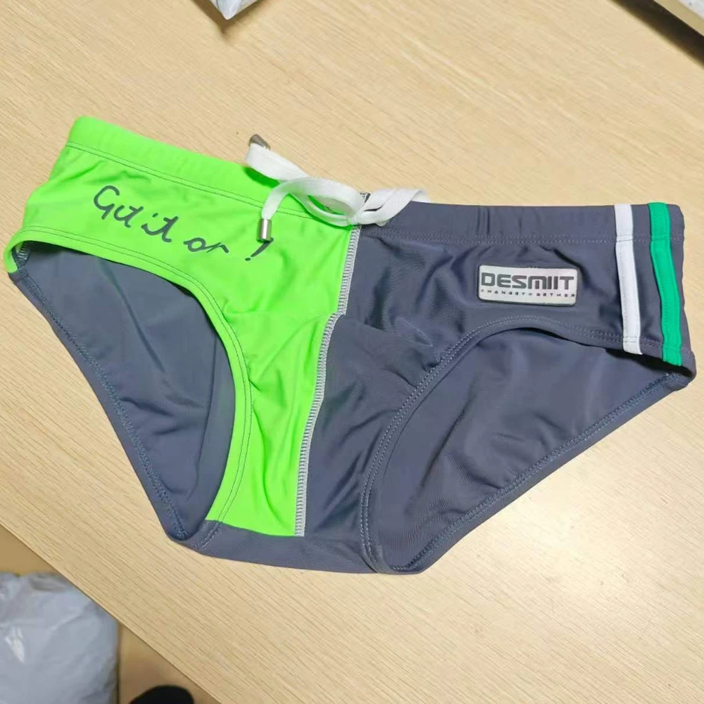 Wholesale supply, real shot men's briefs, low waist, color matching tethered beach swimming trunks DMS01
