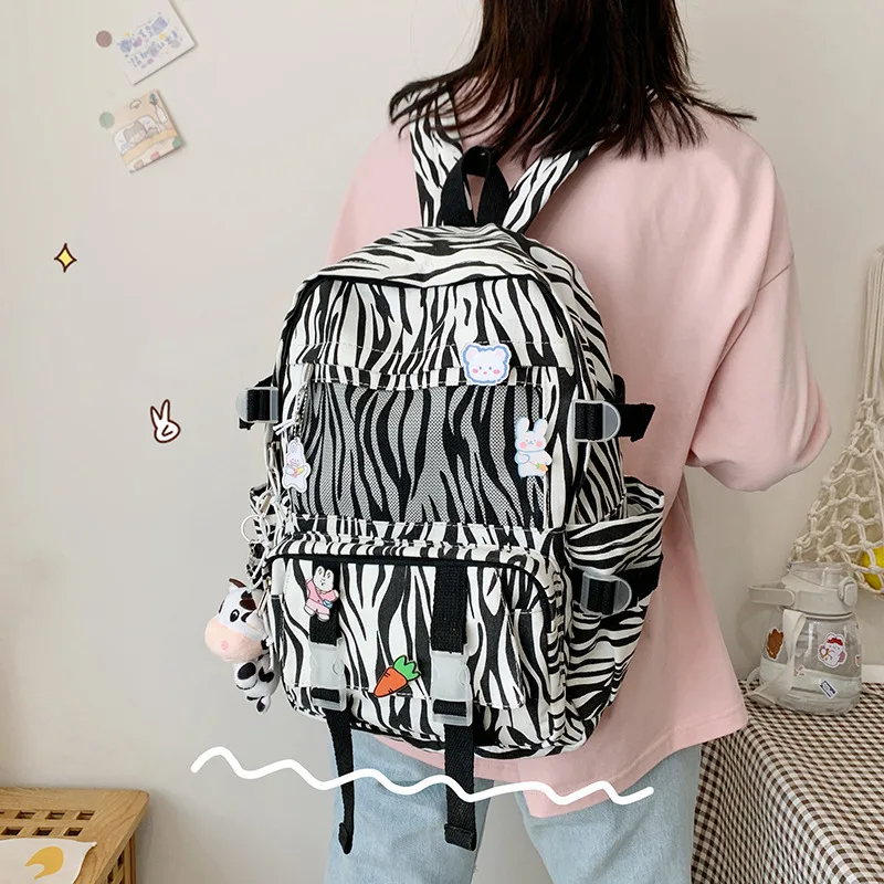 Mochila escolar con patrón de vaca para niña, mochila divertida de gran capacidad para campus, versión coreana, mochila de lona para estudiantes