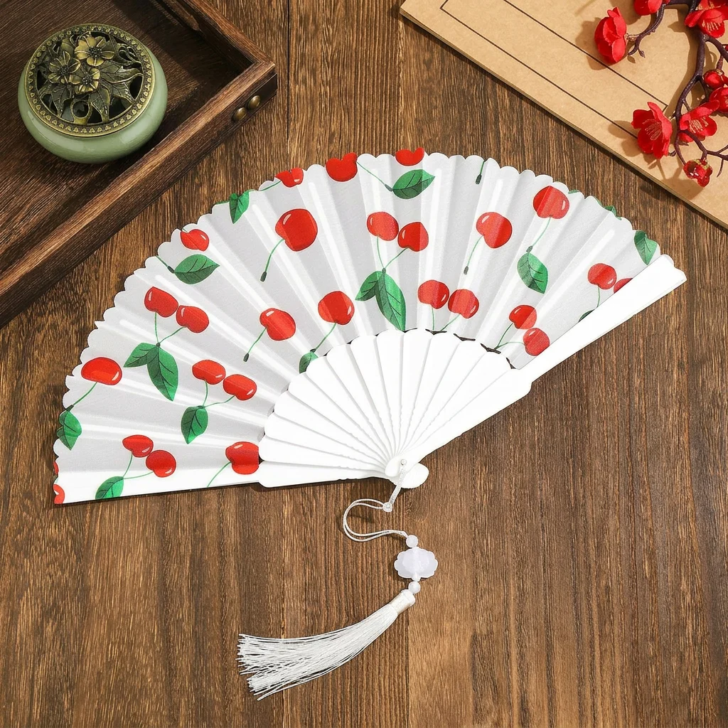 Éventail pliant portable à motif de fruits, avec cadre en plastique et tissu, avec pompon, pour rafraîchissement estival, performance de danse et décoration intérieure