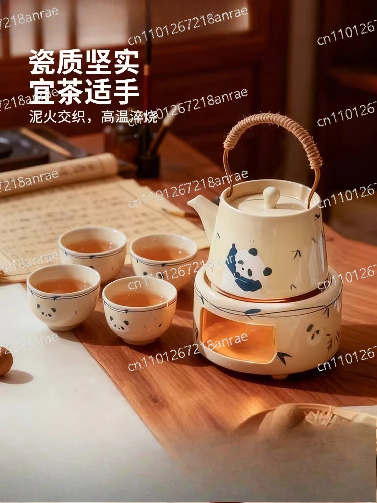 Making teapot, surrounding stove, making tea, household young people's tea set, one person drinking teacup