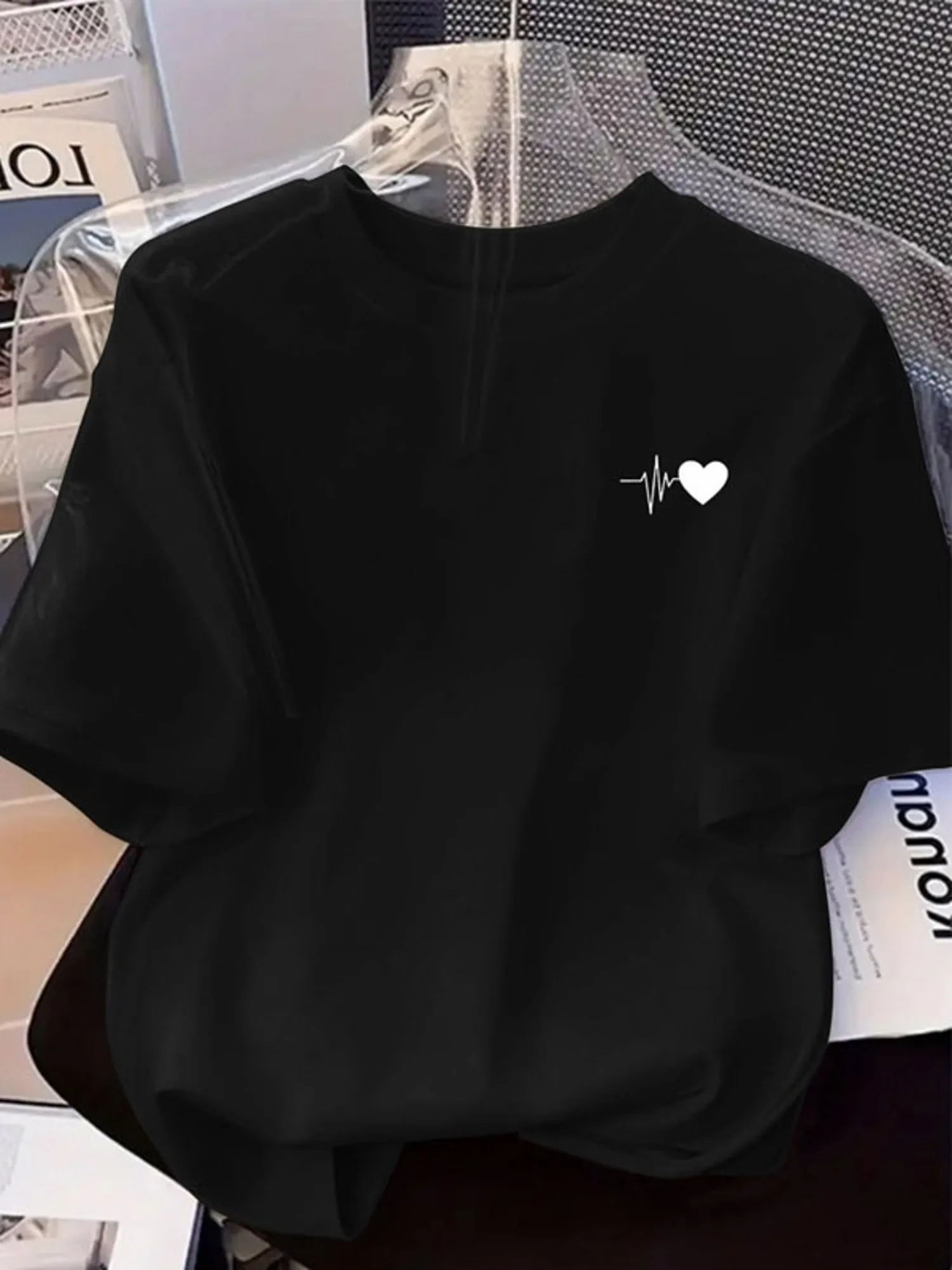 Women Black Crew Neck Short Sleeve T-Shirt, White Heart And ECG Line Graphic Print on Left Chest, Soft Lightweight Breathable Relaxed Fit Casual Basic Tee, Multiple Sizes Available, Perfect for Daily Casual Wear And Relaxed Outings