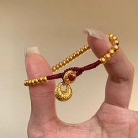 New in antique gold crafts round beads Yuanbao style bracelets red woven rope bag bracelet light luxury simple banquet jewelry