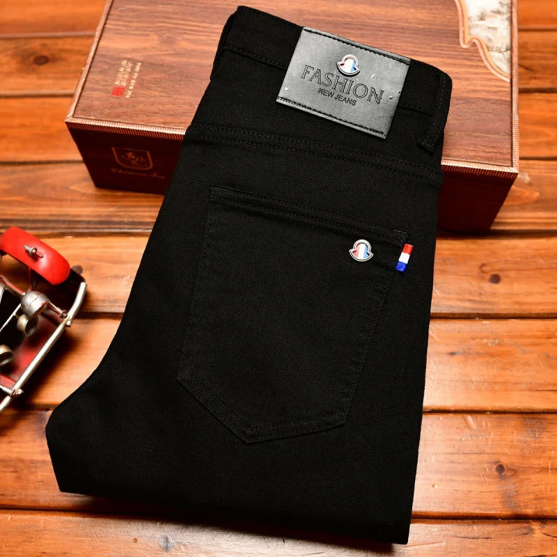 

High end light luxury jeans men's 2026 new style slim fit small feet casual trend simple and fashionable embroidered black pants