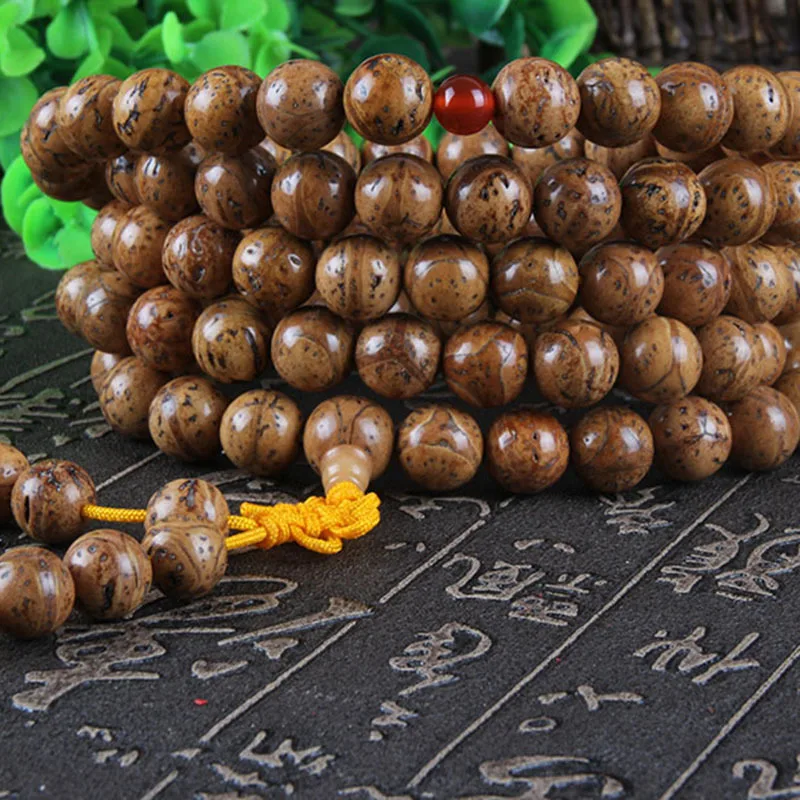 Natural , polished Longan Bodhi seeds, 108 beads for Buddhist prayer, Qilin and tiger eye designs