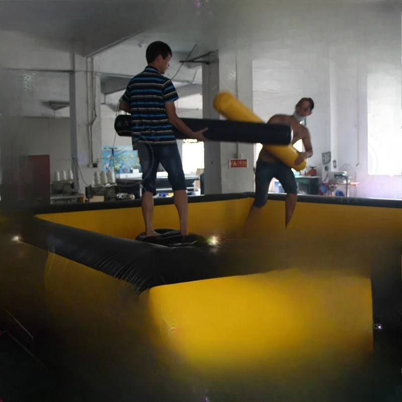 

4X4 yellow and black inflatable gladiator arenas for thrilling team battles, outdoor party games, and competitive events