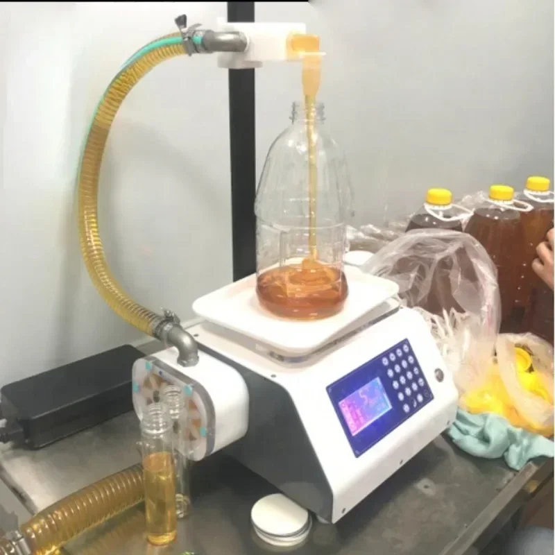 Riempitrice manuale per barattoli di miele Riempitrice manuale per pasta Riempitrice manuale per bottiglieVendita calda economica e fine