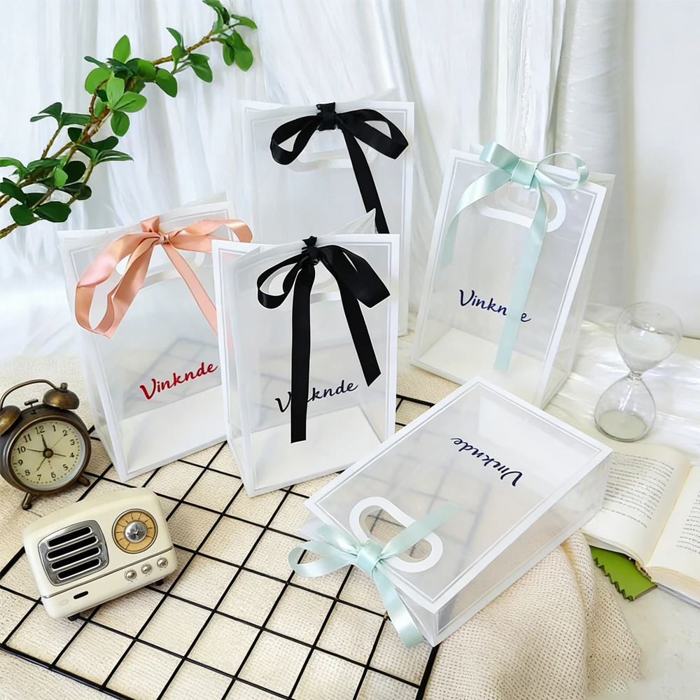 

50pcs Custom Logo PP Pvc Transparent Clothing Plastic Hand Bow Bag Shopping Mall Gift Bags Jewelry Perfume Cosmetic Soap Pouches