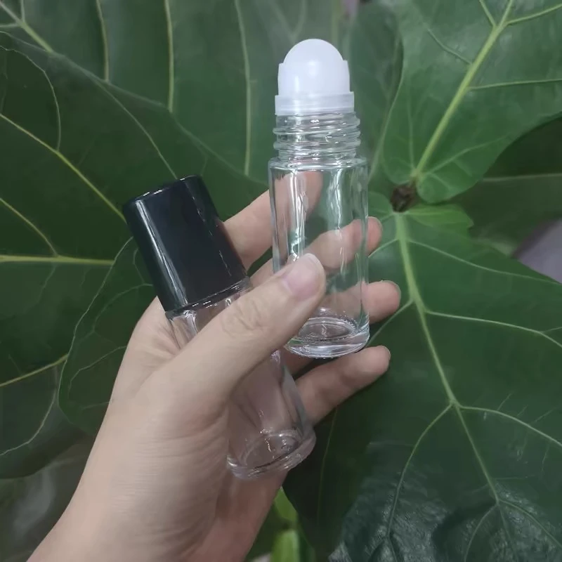 

50pcs 30ml 50ml Clear Glass Roll On Bottles for Essential Oils Refillable Perfume Bottle with Lid Roller Ball Vial