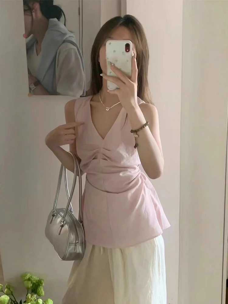 توب نسائي صيفي جديد بدون أكمام يبرز الخصر، تصميم مثير يكشف البطن وبدون ظهر