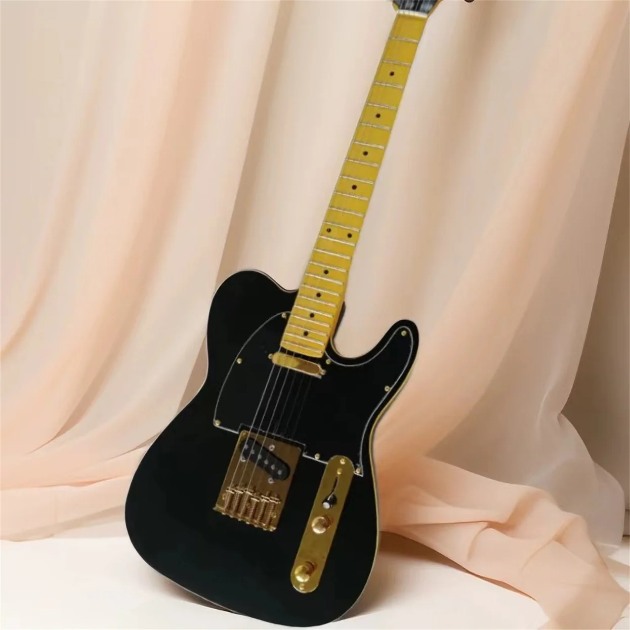 

Factory Matte Black Electric Guitar ,Yellow Binding,Black pickguard,Gold hardware,Provide customized services