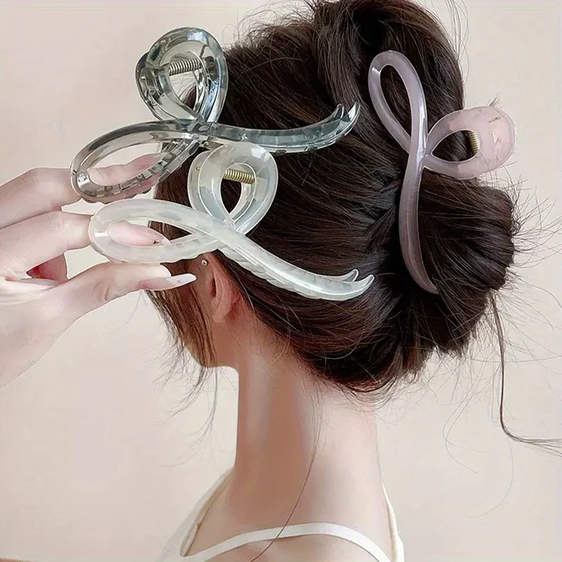 

A Stylish Hair Accessory Featuring a Single Elegant Jelly-Colored Butterfly Bow Hair Claw, Complete