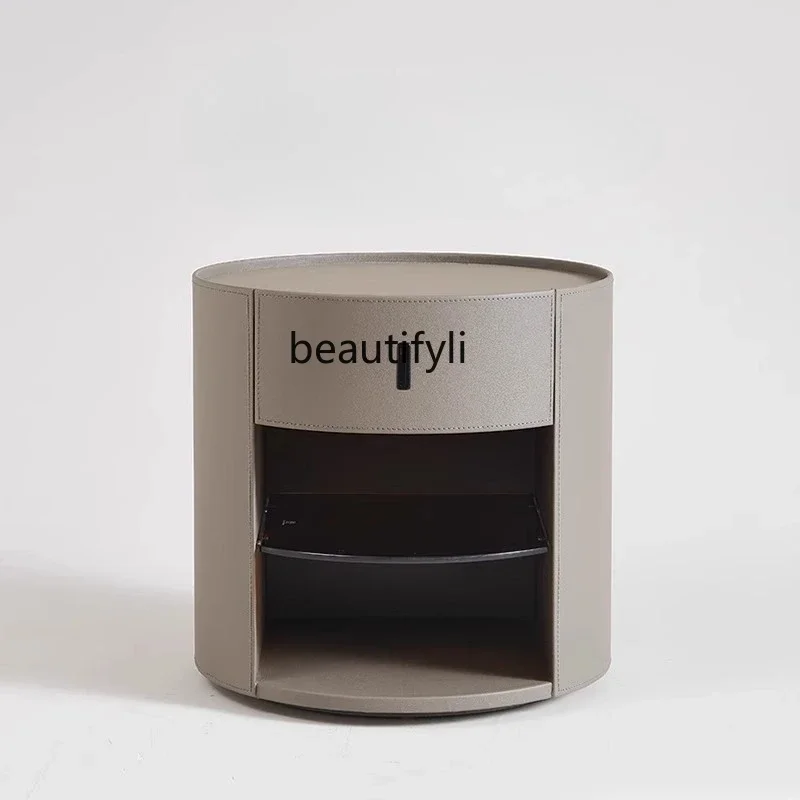 

Italian minimalist round bedside saddle leather bedroom storage creative storage side cabinet