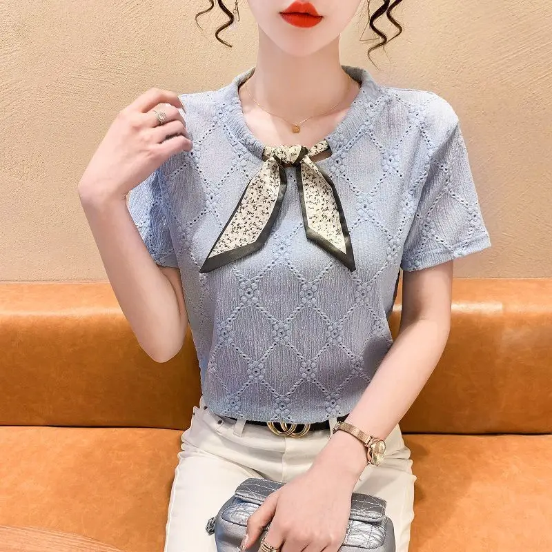 2023 Summer Fashion Korean Edition Round Neck Lace Up Reduced Age Lace Hollow Jacquard Short Sleeve Women\'s Solid Color Shirt