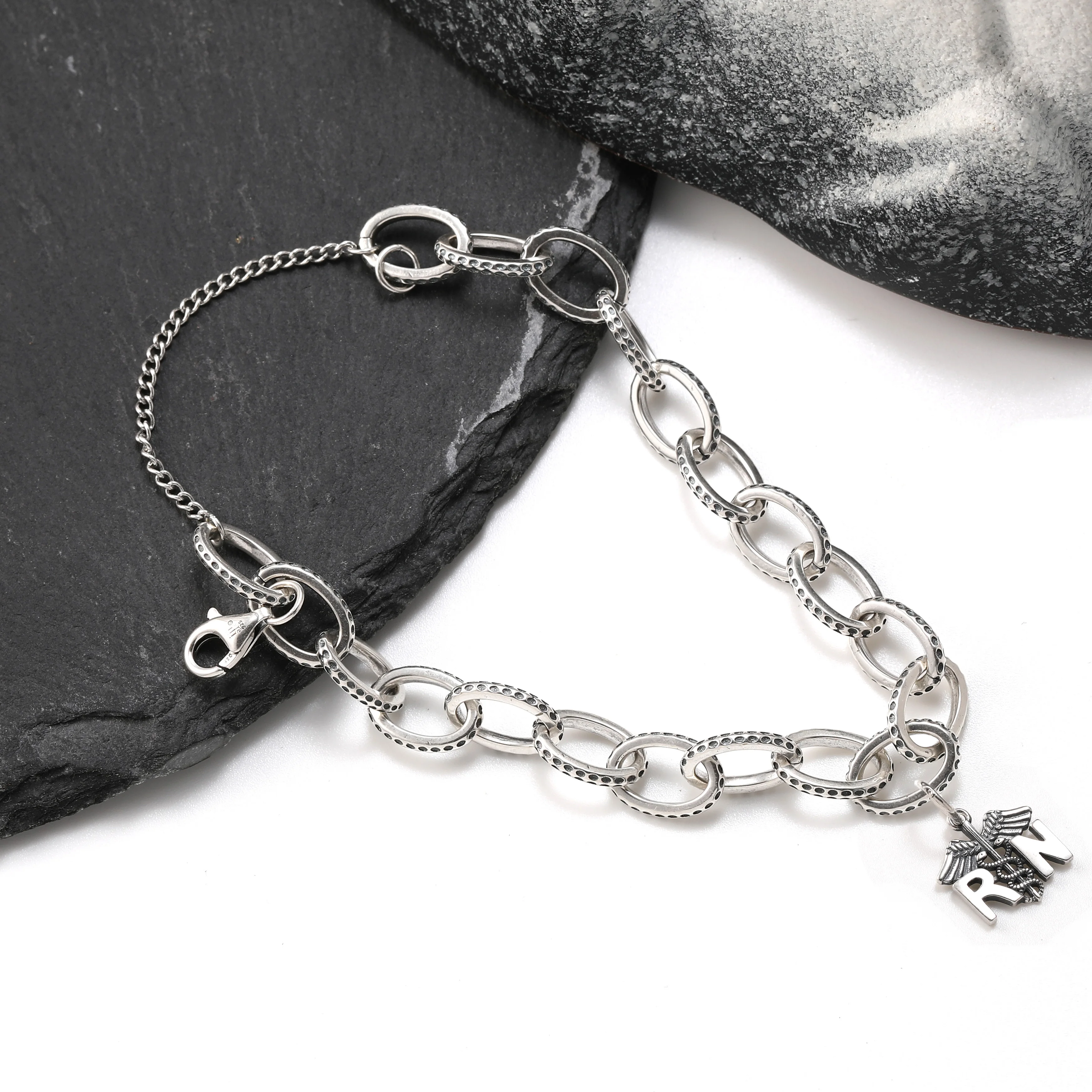 

Genuine 925 sterling silver exquisite Textured Oval Charm Bracelet paired with Romanian Register of Shipping pendant