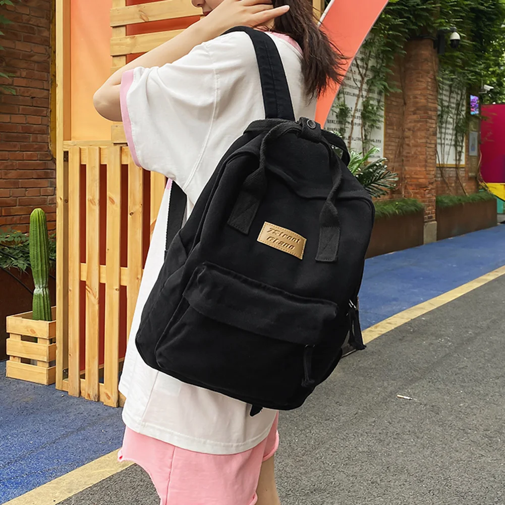 حقيبة ظهر كلاسيكية لطلاب الجامعات من القماش القطني حقيبة كتب كمبيوتر محمول كاجوال بسعة كبيرة بلون سادة حقيبة ظهر عصرية