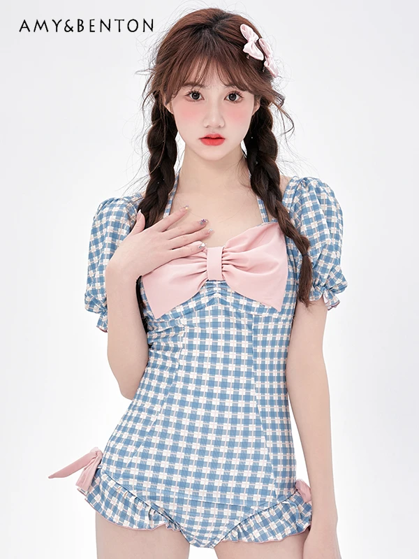 

Женский сплошной купальник с бантом и пышными рукавами