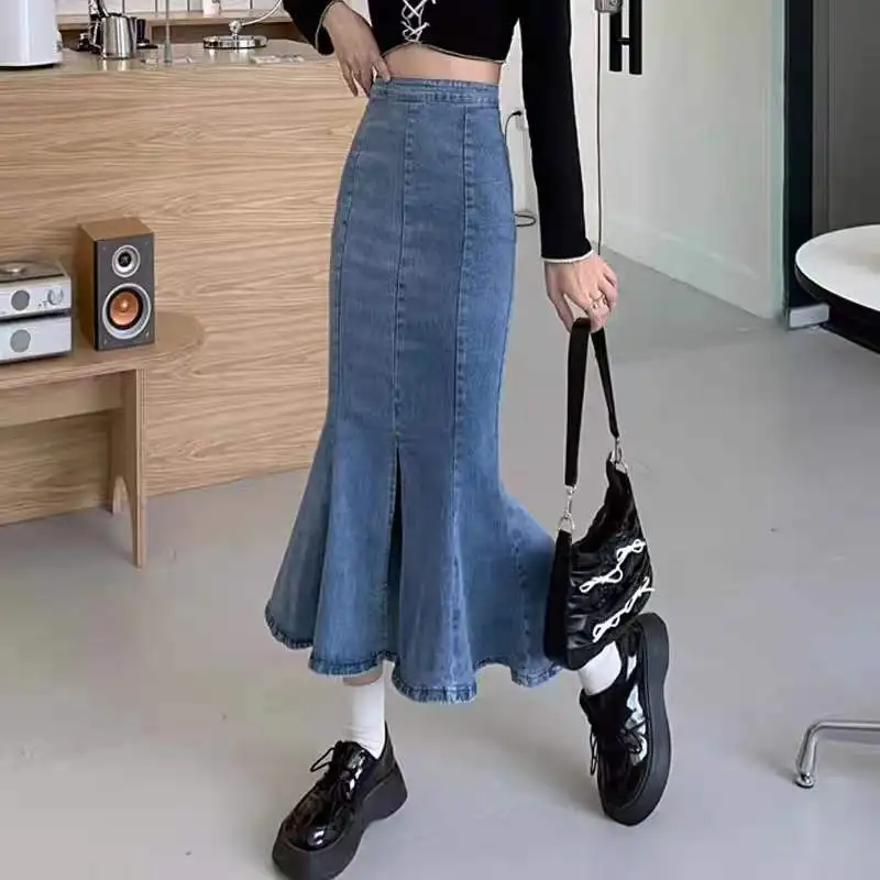 

Новая весенняя женская джинсовая юбка средней длины с разрезом и высокой талией, трапециевидной формы с фи-хвостом, эластичная, для похудения, модная, для контурирования тела