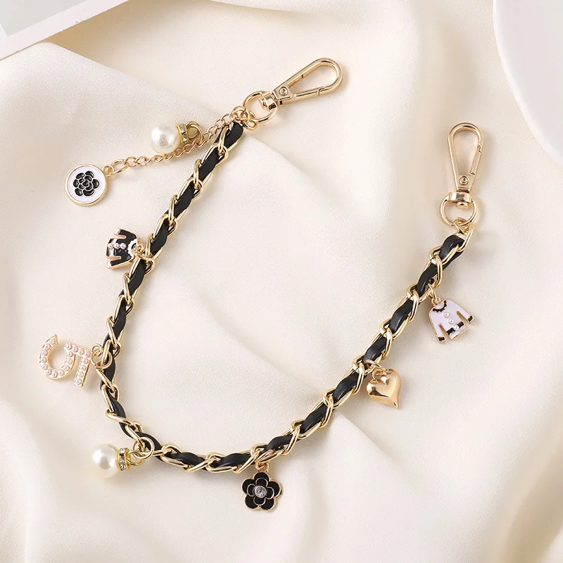 2026 New Women Bag Charm Woven Leather Pearls Hand-held Chain Drop-proof Wrist Phone Case Pendant Accessories Keychain Pendant