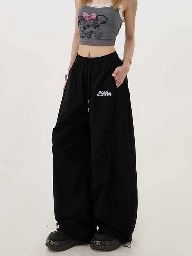 กางเกงทรงพาราชูทขาบานสไตล์ไฮสตรีทสำหรับผู้หญิง ฤดูใบไม้ร่วง-ฤดูหนาว 2025 รุ่น Y2K กางเกงขายาวทรงหลวมสไตล์ฮาราจูกุยุค 2000s แนวกรันจ์อเมริกันย้อนยุคทรงบอยแบงค์