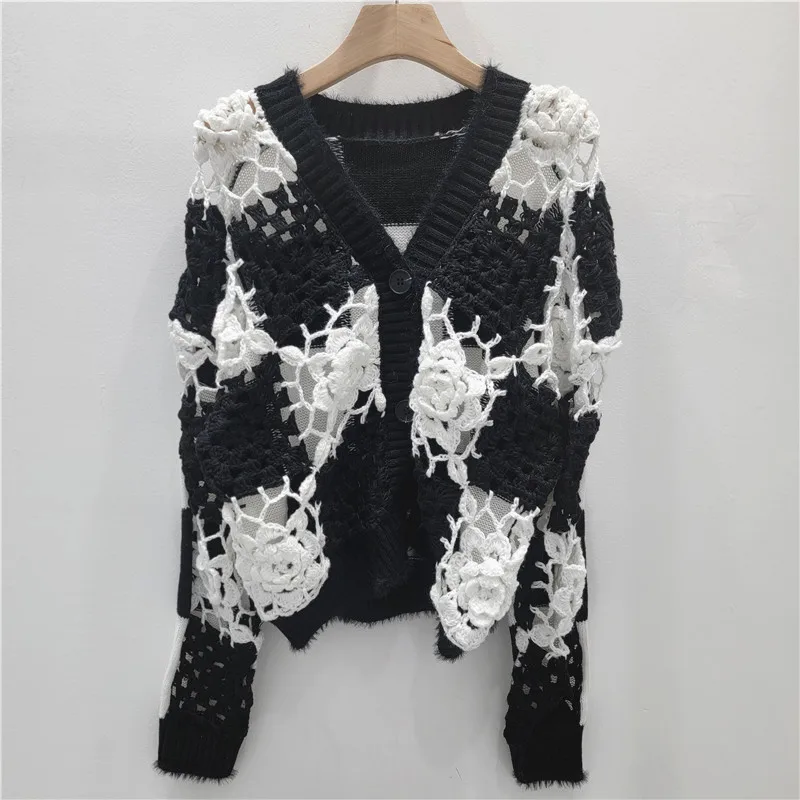 

French-inspired crochet cardigan. Intricate checkerboard pattern & artisanal openwork. A unique, boho-chic statement.