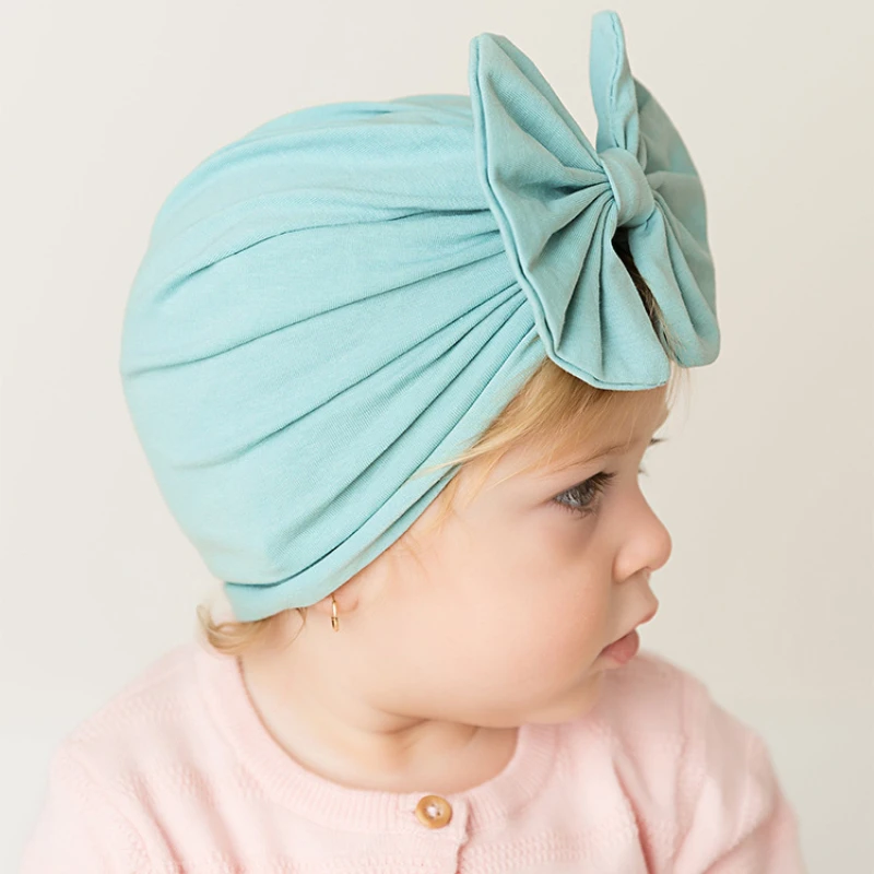 Śliczne Bownot Baby Turban Solid Color dziewczynek chłopców Beanie czapki kapelusz noworodka czapka dla niemowląt czapki elastyczne maluch Headwraps