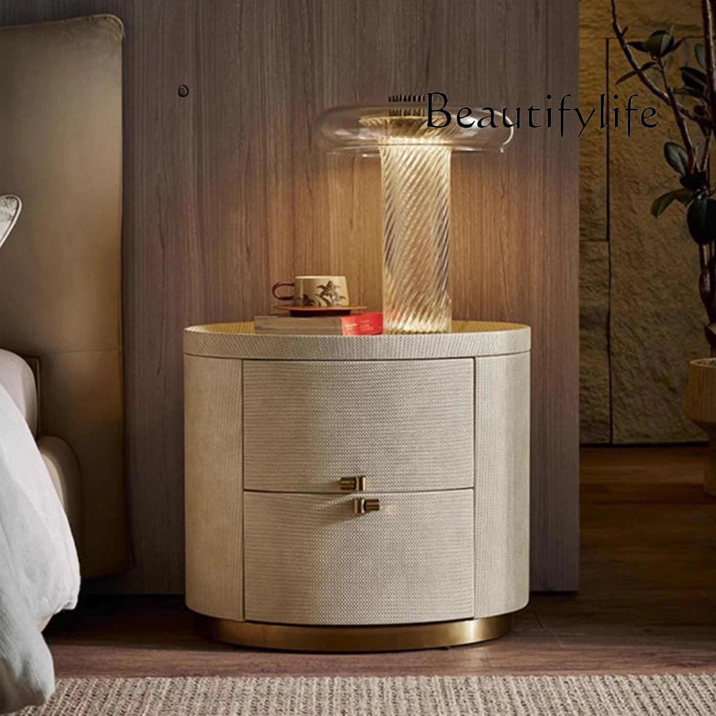 

Italian bedside table oval high-end leather art designer simple American minimalist bedroom storage bedside cabinet