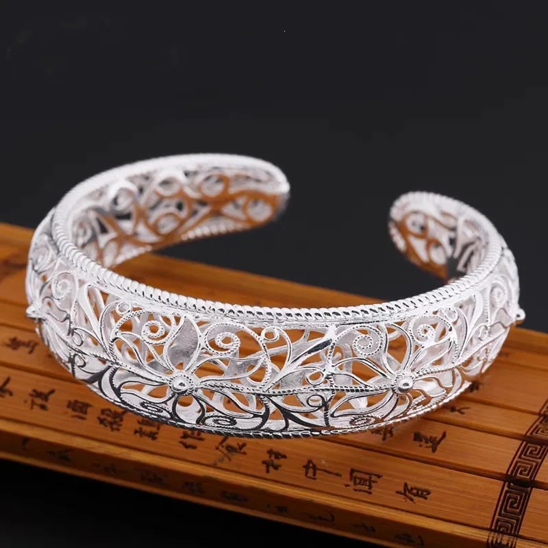 Copper silver-plated openwork filigree wide bracelet featuring a court-style design and adjustable opening