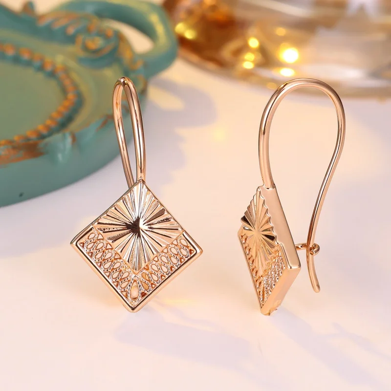 2026 New European and American Retro Diamond Shaped Metal Earrings with Sunshine Pattern and Hollowed Out Floral Accessories