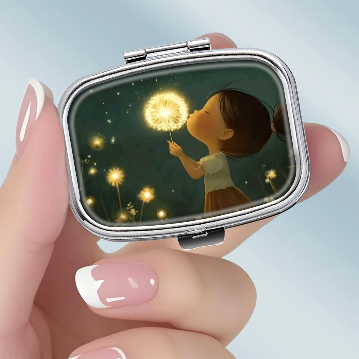 A Portable Square Metal Pill Box Featuring Romantic Nighttime Moments, with a 2-Compartment Design, Perfect for Elegantly Storing Your Medications or Supplements. It Is Perfect for Sorting Vitamins and Storing Small Items.