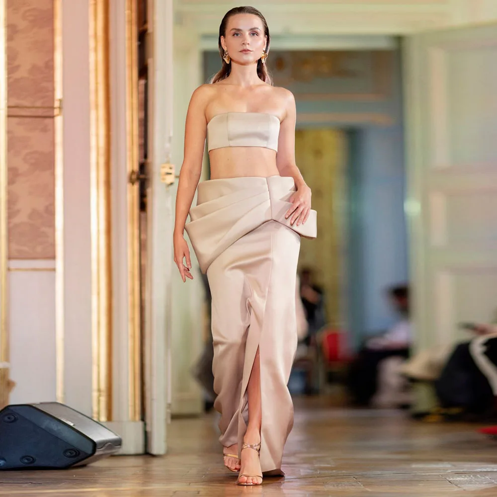 

Pretty Champagne Skirt With Intricate Draping Design Features A High Slit And Structured Waistband Enhancing Feminine Silhouette