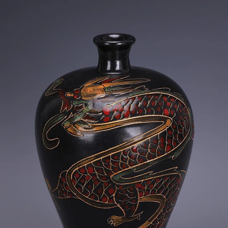 Replica of a Song Dynasty Ding ware black porcelain plum vase with painted dragon design, antique and collectible.