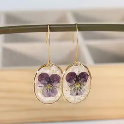 Pendientes creativos de flores naturales para mujer, aretes elegantes de pétalos morados, bonitos pendientes florales de resina epoxi, joyería llamativa al por mayor