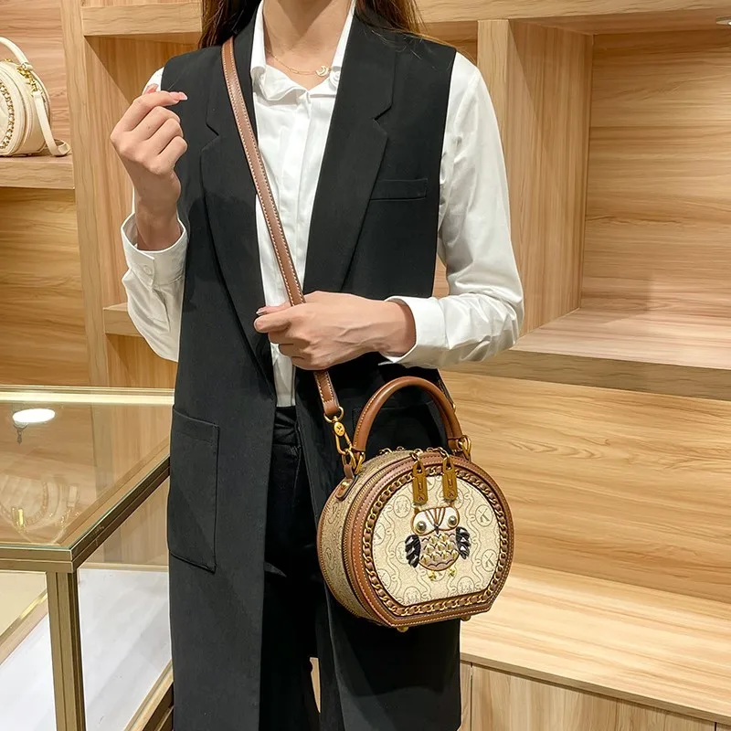 

Brand Bag Women's 2026 New Designer High Quality Handheld Shoulder Bag Contrast Color Diagonal Cross Leather Small Round Bag