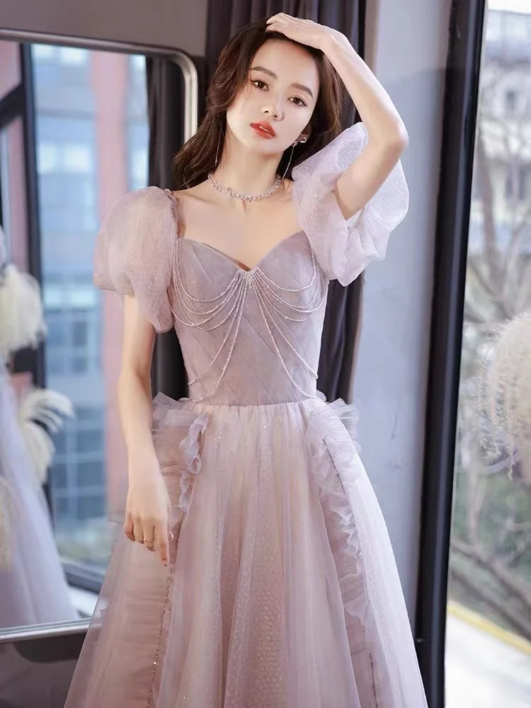 Splendido abito da sera viola rosa Elegante abito da festa formale da donna lungo con perline e maniche a sbuffo in tulle sexy senza schienale con lacci