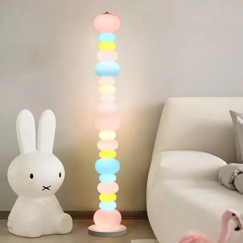 Candy rainbow floor lamp next to bedroom sofa Cream creative floor lamp