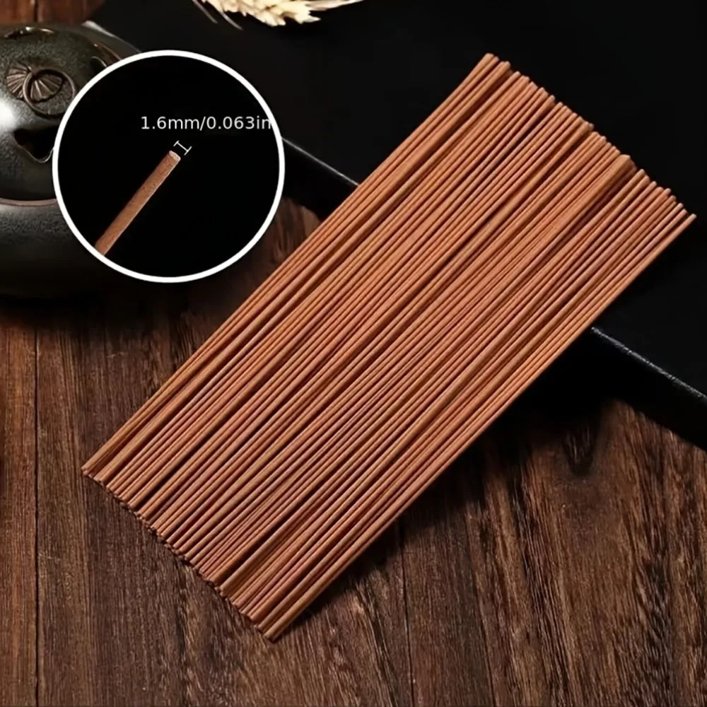A Box of 500 Incense Sticks, 21cm Long, with the Scent of Sandalwood and Medicinal Mugwort, Suitable for Aromatherapy. They Are Placed on a Wooden Board, and the Board Is Placed on a Support Beam. Home Decor Products for Kitchens, Bedrooms, Offices, Yoga, and Outdoor Camping Activities.