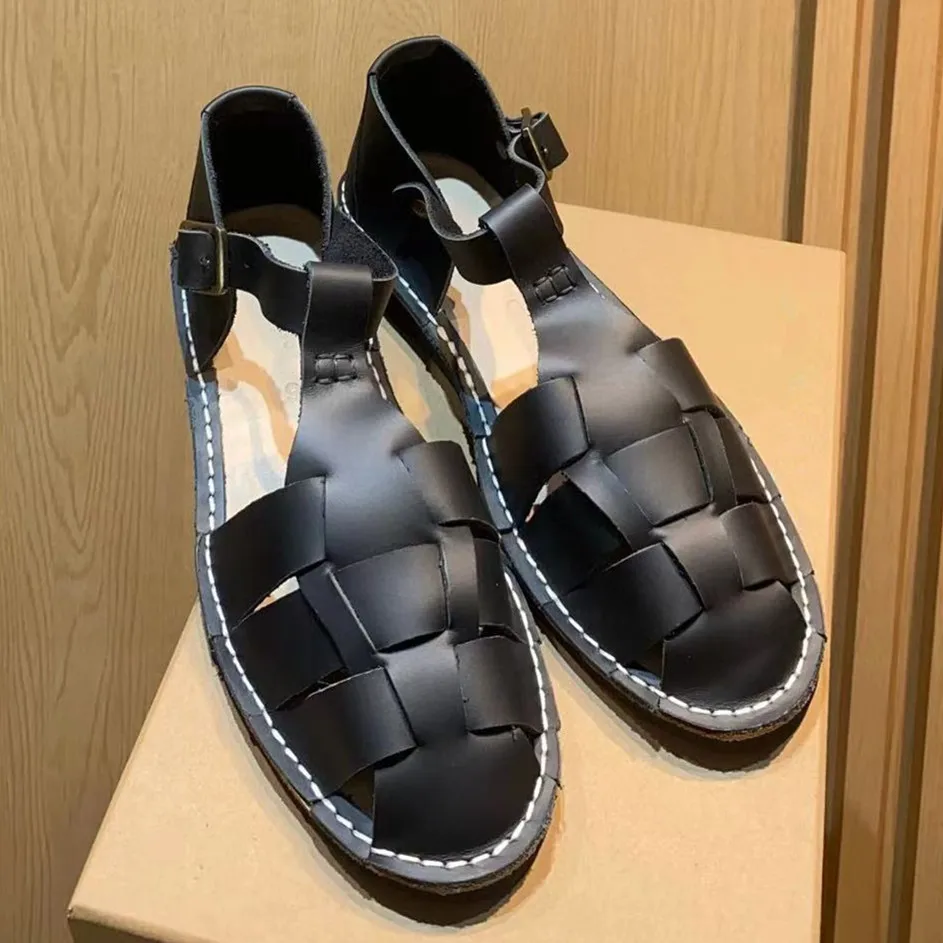 

2024 Spring/Summer New Genuine Leather Hand woven Roman Sandals Women's Bag Head Flat Bottom Low Heel Hollow Pig Cage Shoes