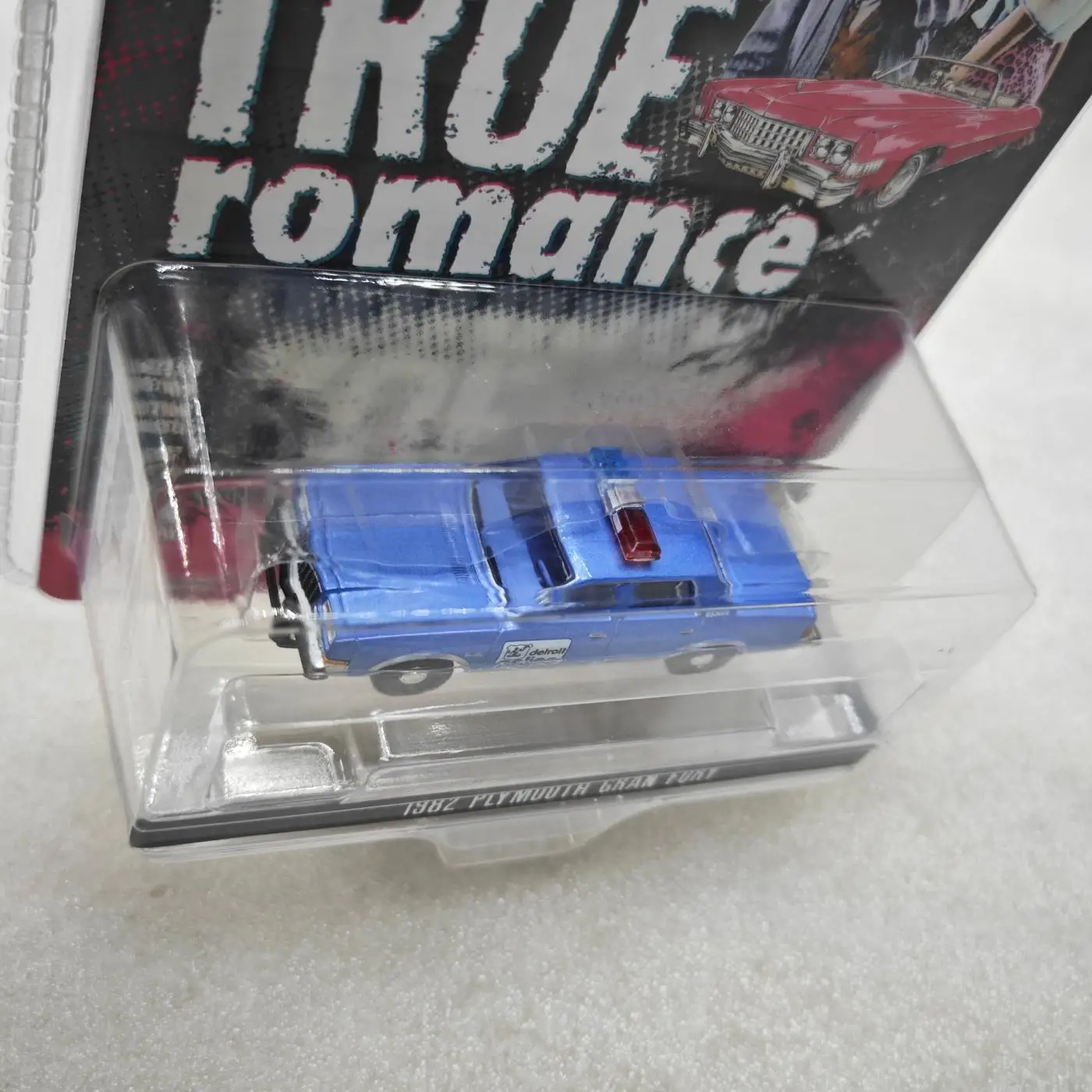 

Green Light 1:64 Hollywood Series 43 True Romance-1982 Plymouth Gran Fury Diecast Alloy Car Model Collectible