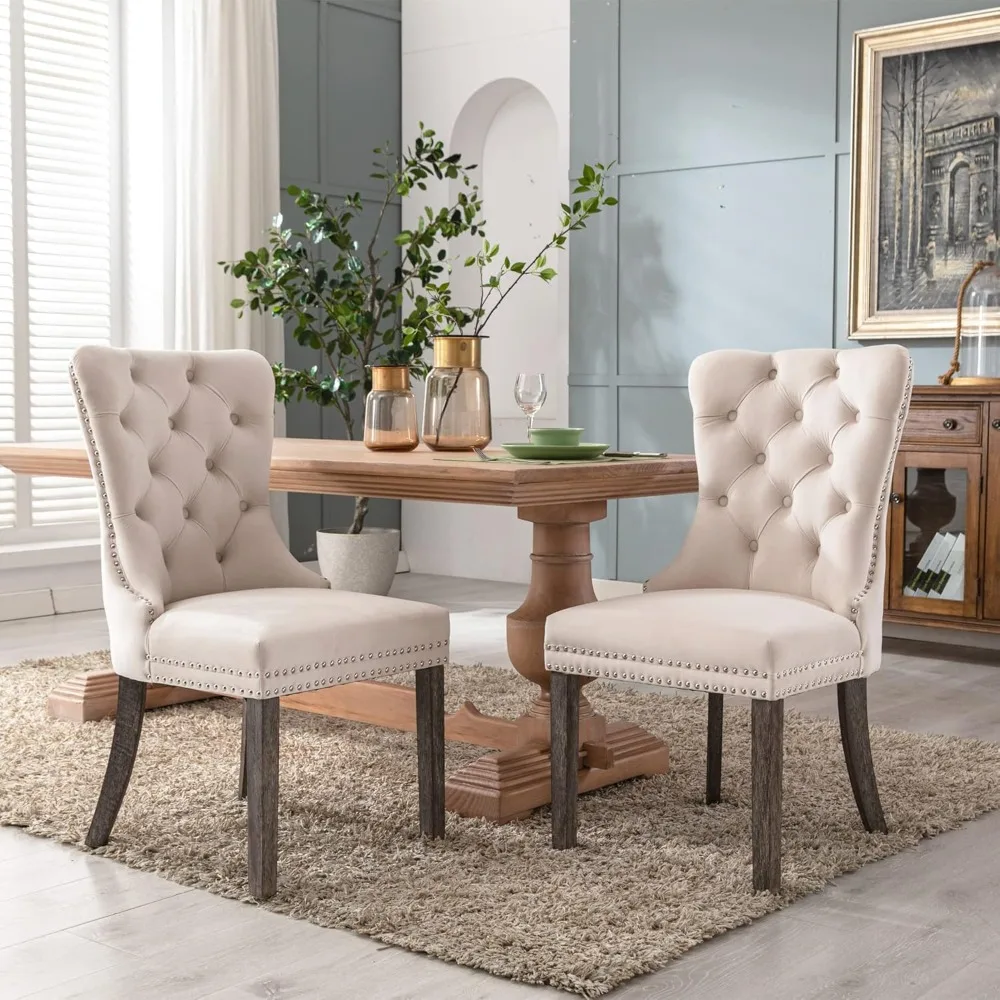 

A set of four velvet dining chairs, high-end clustered velvet dining chairs with nail heads and back ring pull decorations