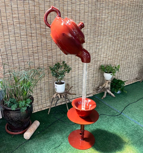 Indoor hanging water flowing water sky kettle tea house hotel entrance kettle fountain view