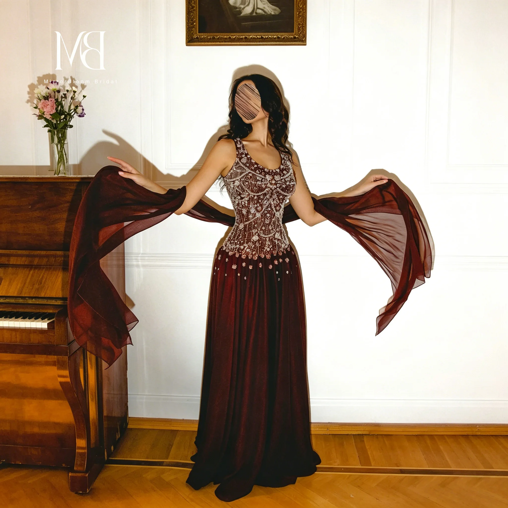 Burgundy strapless maxi dress with spaghetti straps a formal gown featuring crystal and bead embellishments
