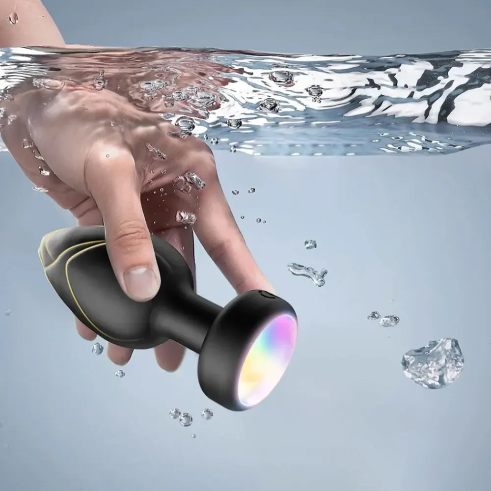 เครื่องสั่นทางทวารหนักแบบไร้สายพร้อมรีโมทคอนโทรลไฟ LED เครื่องนวดต่อมลูกหมากสำหรับเซ็กซ์ทอยผู้ใหญ่