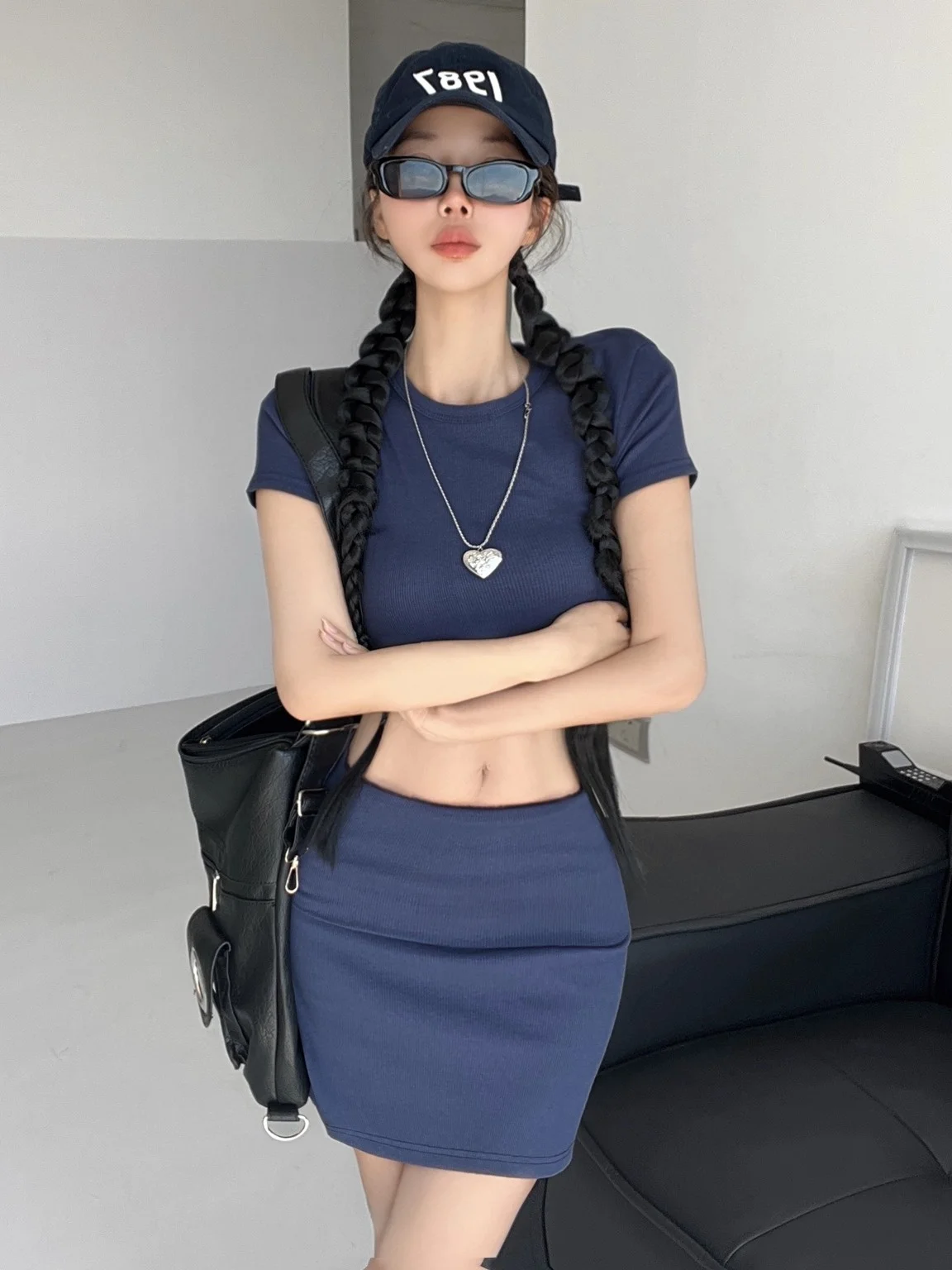 Conjunto Sexy de dos piezas de punto, falda ortopé ajustada de cintura baja, Top redondo Ne, conjunto Faion para mujer, colección de verano ort Sve