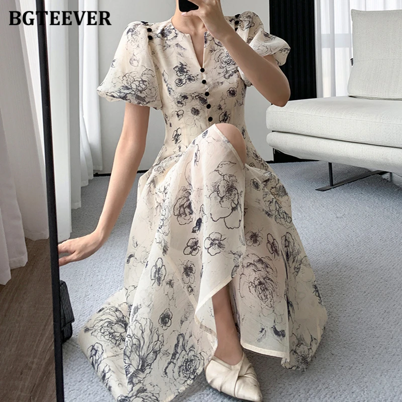 فستان BGTEEVER أنيق برقبة على شكل حرف V وخصر نحيف مزين بالزهور للنساء للربيع والصيف وأكمام منتفخة مطبوعة على شكل حرف a فستان نسائي