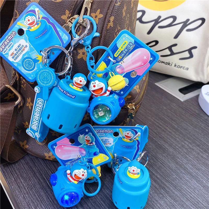 Doraemon sleutelhanger hanger ruimteschip omgevingslicht gopher machine sleutelhanger cartoon sieraden decoraties kawaii auto sleutelhanger charme