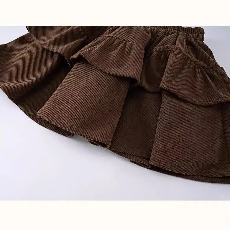 تنورة قصيرة جديدة لخريف وشتاء 2025 للفتيات تنورة كعكة عصرية للأطفال تنورة مطوية مع سراويل أمان