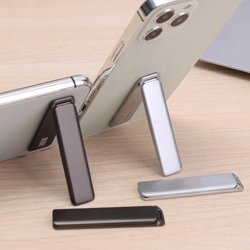 Supporto per telefono magnetico Staffa per cavalletto per telefono autoadesiva in metallo Supporto per telefono cellulare da tavolo pieghevole invisibile ultra sottile