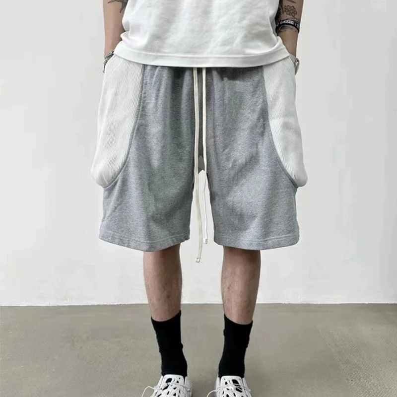 

Parisian Sle Men's Loose Fit ort Pants with Large kets Splicing 3D Cutting Dstring Summer Casual orts