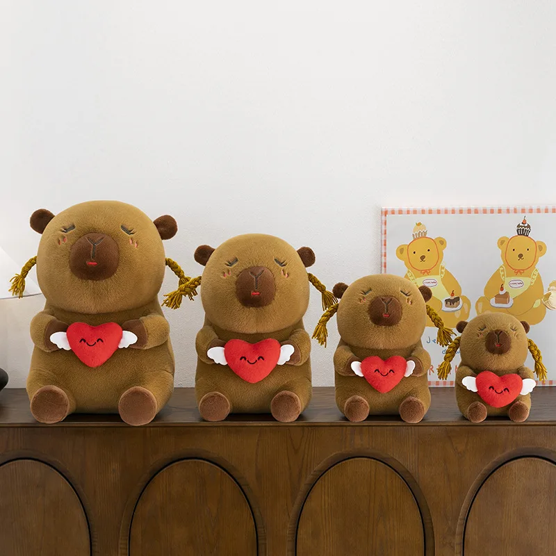 Urocza, brzydka, urocza pluszowa kapibara z kokardkami w kształcie serca, wypchana maskotka, poduszka, lalka dla dzieci, prezent na urodziny, Boże Narodzenie, miękka, przytulna zabawka.