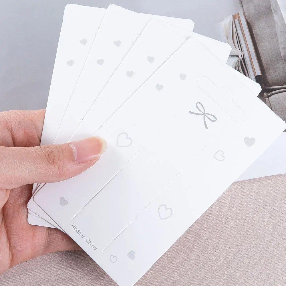 

50 шт./лот, 12x7 см, белые демонстрационные карты с бантом, карта из крафт-бумаги для DIY ювелирных изделий, заколки для волос, заколки для волос, упаковочные бирки, розничная этикетка